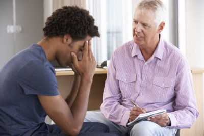 Young Man Having Counselling Session