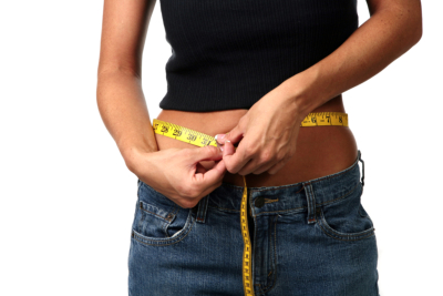 Dieting Woman Measuring Her Waist Line on White