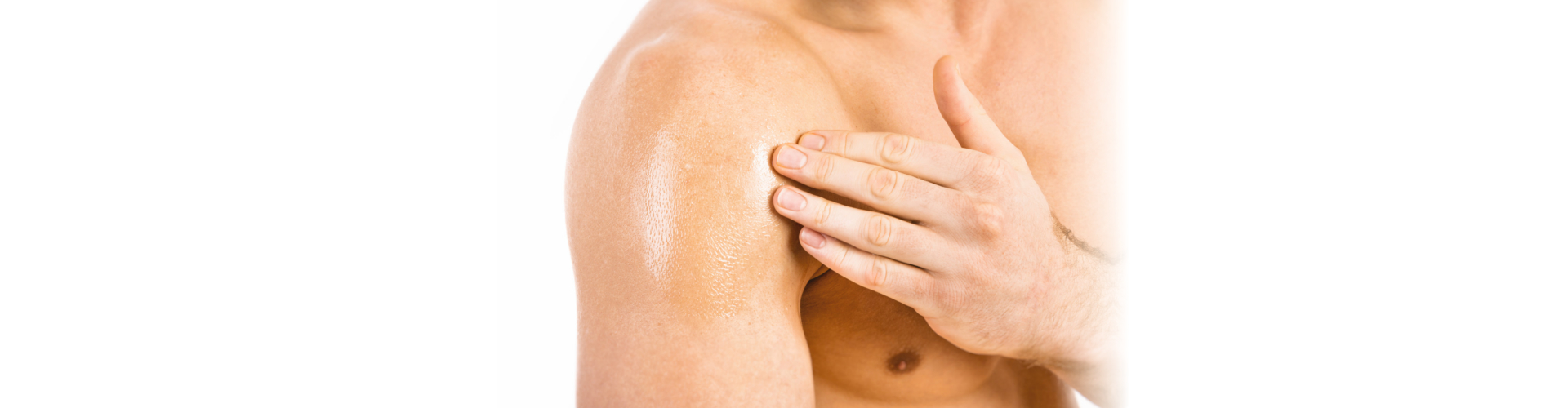 Muscular man applying testosterone gel on shoulder